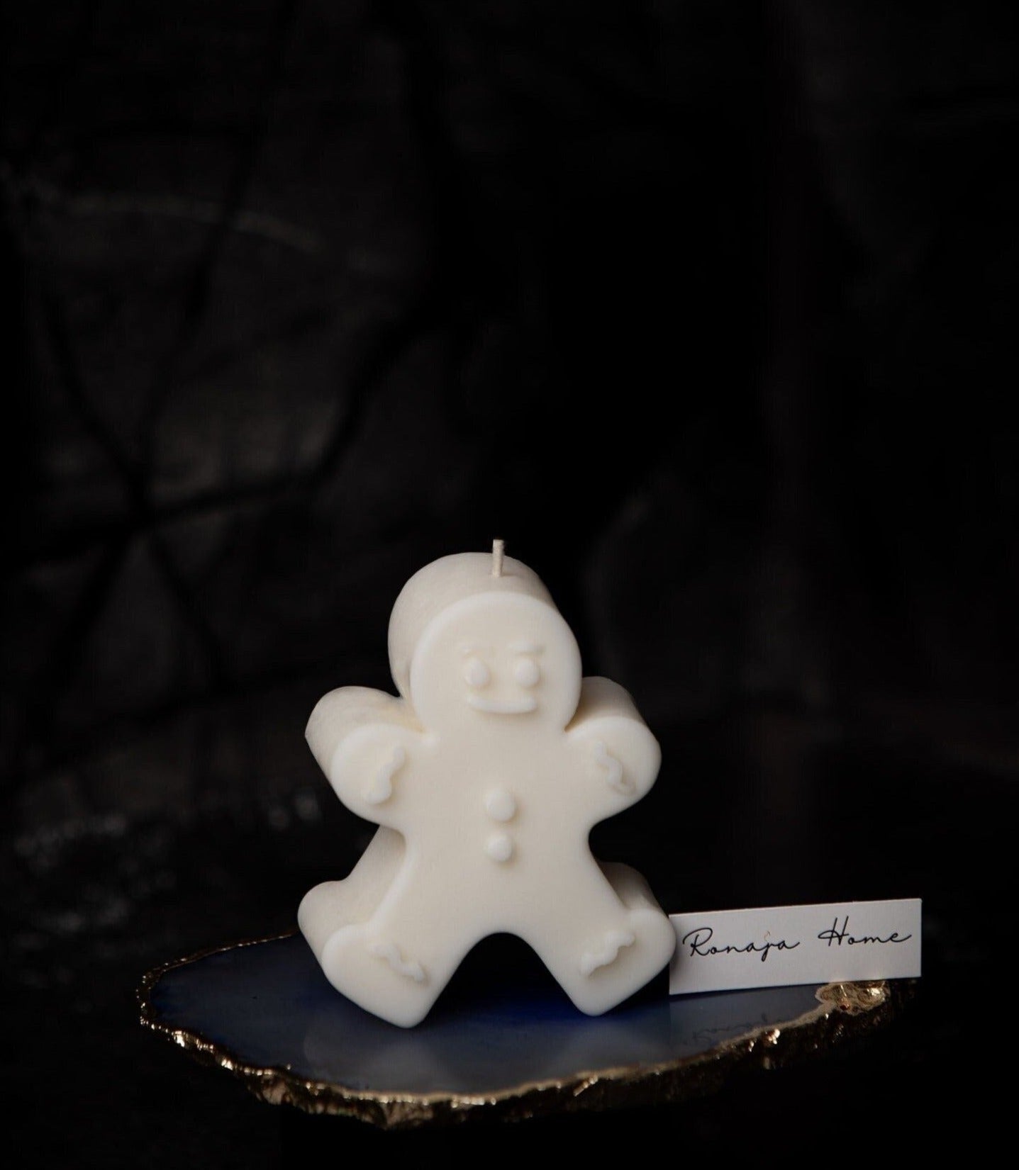 Piccola candela a forma di omino di pan di zenzero