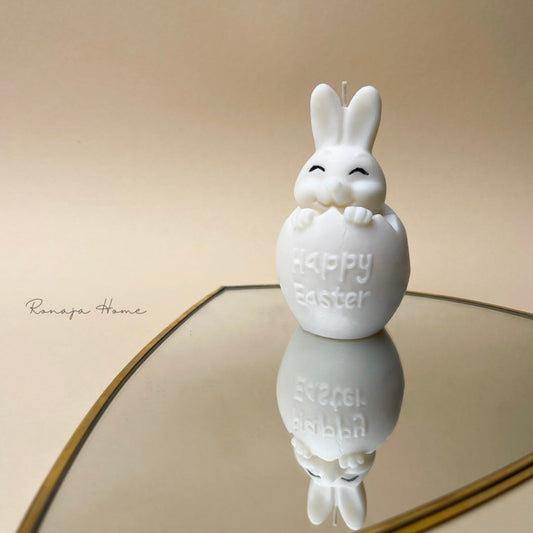 Handmade soy wax Easter bunny in an egg candle in white.