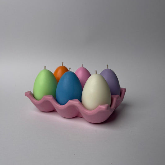 Pastel handmade Easter Egg Candles arranged as spring holiday décor.